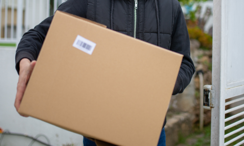 Cardboard box being carried